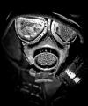 I'm a professional photographer, and this is a self shot gas mask I did of myself, and edited like Sin City.