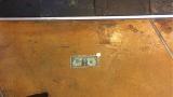 This restaurant glued its first dollar and quarter to the floor.