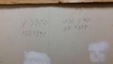 Weird message in Walmart stockroom, can anyone decypher it?