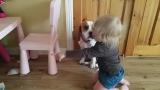 Sweet toddler consoles and hugs her dog even though he broke her bowl