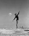 Dancer with a nuclear explosion in the background, Nevada, 1950's