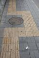 In Beijing, the markings for blind people can exist purely to guide them around a manhole, as stepping on one is seen as very bad luck here.