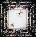 An overhead shot of Muhammad Ali celebrating a knockdown