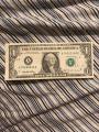This off-center dollar bill