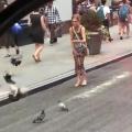 Lady catch a injured bird and take her to the vet
