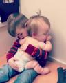 Big Brother rocks his baby sister to sleep