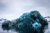 An iceberg flipped over, and its underside is breathtaking.