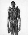 7 foot Bolaji Badejo, a nigerian design student and one time actor wearing his costume for the now classic sci-fi thriller Alien, 1978