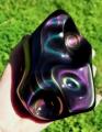 A shiny piece of rainbow obsidian