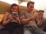 Scarlett Johansson and Chris Evans gaming together.