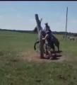 Man does a 360° around a horse