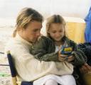 Heath Ledger hanging out with Skye McCole Bartusiak while she plays Gameboy on set of The Patriot