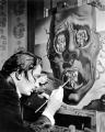 Candid Photograph of Salvador Dalí Painting in His Studio