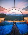 This transparent tent with a sunset view of Mount Rainier.