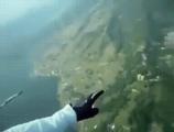 A bird stops by to visit a skydiver