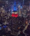 The Empire State Building in New York is displaying red white and blue lights tonight