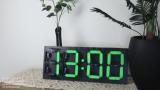 Mechanical 7-segment display clock driven by 28 servos controlled by an Arduino