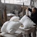 This guy sculpts stone into realistic pillows.