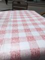 The classic red checkered pattern of the tablecloth of this restaurant is made of QR codes for their menu