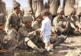 A French boy introduces himself to Indian soldiers who had just arrived in France to fight alongside French and British forces, Marseilles, 30th September 1914. [Colorization] [1755x1227]
