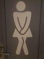 These toilets have a person as symbol that clearly needs to go.