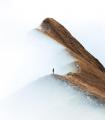 A girl standing on a ridge in Switzerland. Photo by Daniel Ernst.