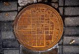 Manhole covers in Oklahoma have a city map on them with a white dot showing where you are.