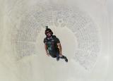 Picture of a guy skyding into Burning Man.