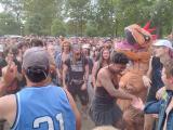 Someone in a dinosaur suit in a punk mosh pit [OC]